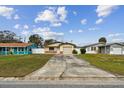 Front view of the house showing its landscaping and driveway at 1885 Mississippi Ne Ave, St Petersburg, FL 33703