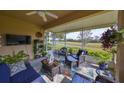 Relaxing screened porch overlooking a lush green golf course at 2019 Acadia Greens Dr # 34, Sun City Center, FL 33573