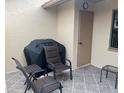 Relaxing back patio with seating and grill at 38245 Ironwood Pl # 0, Zephyrhills, FL 33542