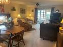 Bright living room with comfortable seating and dining area at 38245 Ironwood Pl # 0, Zephyrhills, FL 33542