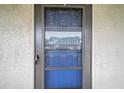 Condo's front door with storm door and number 320 at 5567 Sea Forest Dr # 320, New Port Richey, FL 34652