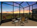 Bright sunroom with seating area and scenic backyard views at 5672 Bay Tide Ct, Land O Lakes, FL 34638