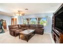 Spacious living room with large windows and comfortable sectional sofa at 6004 1St W Ave, Bradenton, FL 34209