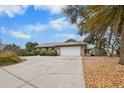 Single story home with attached garage and well-maintained landscaping at 6208 Spanish Main Dr, Apollo Beach, FL 33572