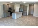 Open concept kitchen with island and granite countertops at 9143 Hillcroft Dr, Riverview, FL 33578