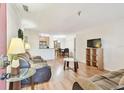 Bright living room with comfy couches and a view into the kitchen and dining area at 10265 Gandy N Blvd # 1715, St Petersburg, FL 33702