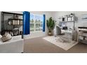 Bright and airy home office with built-in shelving and window at 14467 Hawk Rd, Brooksville, FL 34614