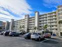 Building exterior showcasing a multi-story building with parking at 18650 Gulf Blvd # 413, Indian Shores, FL 33785