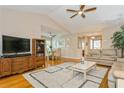 Bright and airy living room offering hardwood floors and a comfortable seating area at 2509 Lynx Rd # 0, Sun City Center, FL 33573