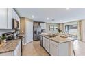 Modern kitchen featuring granite countertops and stainless steel appliances at 35161 Valley Ridge Rd, Dade City, FL 33525