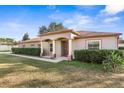 Charming one-story home with a covered entryway and manicured lawn at 6515 Clair Shore Dr, Apollo Beach, FL 33572