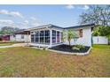 Ranch house with carport and partially visible yard at 7210 E Cayuga St, Tampa, FL 33610