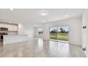 Open living area with sliding glass doors at 12213 Tranquil Waters Ter, Parrish, FL 34219