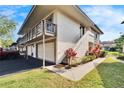Two-story condo with a double garage and walkway at 1849 Bough Ave # D, Clearwater, FL 33760