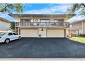Front view of a two-story condo with a double garage at 1849 Bough Ave # D, Clearwater, FL 33760