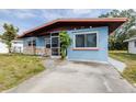 Ranch style home with a carport and well-maintained lawn at 1907 27Th W St, Bradenton, FL 34205