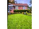 Neatly landscaped front yard with lush green grass at 2504 Highland S St, St Petersburg, FL 33705