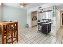 Condo dining area with kitchen views and small table with chairs at 2630 Pearce Dr # 102, Clearwater, FL 33764