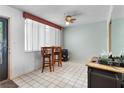 Condo dining area with kitchen views and small table with chairs at 2630 Pearce Dr # 102, Clearwater, FL 33764