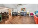 Spacious living room with hardwood floors, and leather furniture at 4113 Barret Ave, Plant City, FL 33566
