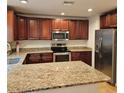 Spacious kitchen with granite countertops and stainless steel appliances at 604 8Th Sw St, Ruskin, FL 33570