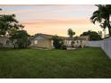 Spacious backyard with a large grassy area at 7698 Cardiff Ct, St Petersburg, FL 33709