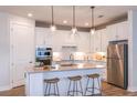 Modern kitchen featuring island and stainless steel appliances at 9413 Barnacle Ln, Parrish, FL 34219