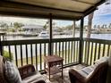 Relaxing screened balcony overlooking the water, featuring wicker furniture at 1028 Apollo Beach Blvd # 11, Apollo Beach, FL 33572