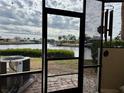 View from screened patio showing water access and boats at 1028 Apollo Beach Blvd # 11, Apollo Beach, FL 33572
