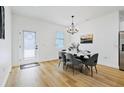 Bright dining room features a chandelier and gray chairs at 14469 Bulger Ave, Port Charlotte, FL 33953