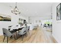 Open floor plan with dining, kitchen, and living areas at 14469 Bulger Ave, Port Charlotte, FL 33953