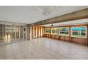 Open living space with tiled floors, under renovation, and backyard view at 159 Danforth Dr, Punta Gorda, FL 33980