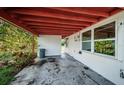 Covered patio area with concrete flooring at 1820 Sutherland W Dr, Palm Harbor, FL 34683