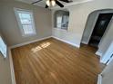 Light-filled living room with hardwood floors and a pass-through to the kitchen at 1829 31St N Ave, St Petersburg, FL 33713