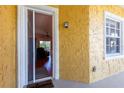 Inviting entryway with a screen door leading to a comfortably furnished living area at 21012 Picasso Ct # J205, Land O Lakes, FL 34637