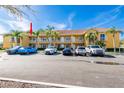 Building exterior with ample parking and a sunny, desirable location at 21012 Picasso Ct # J205, Land O Lakes, FL 34637