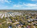 Neighborhood with various homes and a lake at 3724 15Th Se Ave, Largo, FL 33771