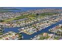 Bird's-eye view of waterfront community with many homes and canals at 4514 Dewey Dr, New Port Richey, FL 34652