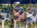 Aerial view showing home's layout, pool, and canal-side location at 4531 Swordfish Dr, Bradenton, FL 34208