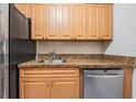 Kitchen boasts granite countertops and ample wood cabinetry at 5221 Bayshore Blvd # 37, Tampa, FL 33611