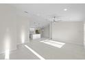 Bright and airy living room with high ceilings and recessed lighting at 7258 Bridgeport Ln, Englewood, FL 34224