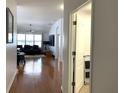 Bright entryway with hardwood floors and views into the living room and an office at 8408 Canterbury Lake Blvd, Tampa, FL 33619