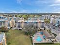 Aerial view of condo building and resort-style pool at 960 Starkey Rd # 5301, Largo, FL 33771