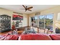 Living room with hardwood floors, balcony access, and comfy seating at 960 Starkey Rd # 5301, Largo, FL 33771
