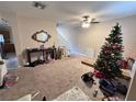 Spacious living room with carpeted floors and a Christmas tree at 9822 Carlsdale Dr, Riverview, FL 33578
