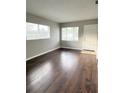 Living room with hardwood floors and neutral walls at 1605 E Bougainvillea Ave, Tampa, FL 33612