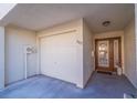 Attached garage with front entrance and access to home at 262 Madeira Cir, Tierra Verde, FL 33715