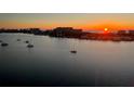 Stunning aerial view of waterfront homes at sunset at 660 Island Way # 1005, Clearwater Beach, FL 33767