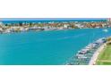 Aerial view of waterfront homes and boats on sunny day at 660 Island Way # 1005, Clearwater Beach, FL 33767