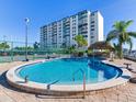 Community pool with tennis courts nearby at 660 Island Way # 1005, Clearwater Beach, FL 33767